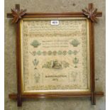 A Victorian ornate oak framed alphabet, verse and seated figure decorated sampler by Helena Lloyd