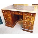 A 3' 9" 19th Century walnut knee-hole writing desk with leather inset top, central frieze drawer and