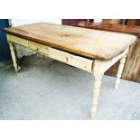 A 6' late 19th Century pine scrub top farmhouse kitchen table with three frieze drawers, set on ring