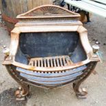 A reproduction cast iron and gilt metal Georgian style fire basket