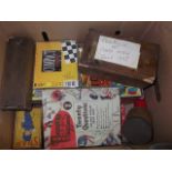 A box containing various card games, dominoes etc