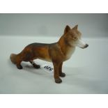 A ROYAL CROWN DERBY PORCELAIN FOX, standing, length approximately 18cm