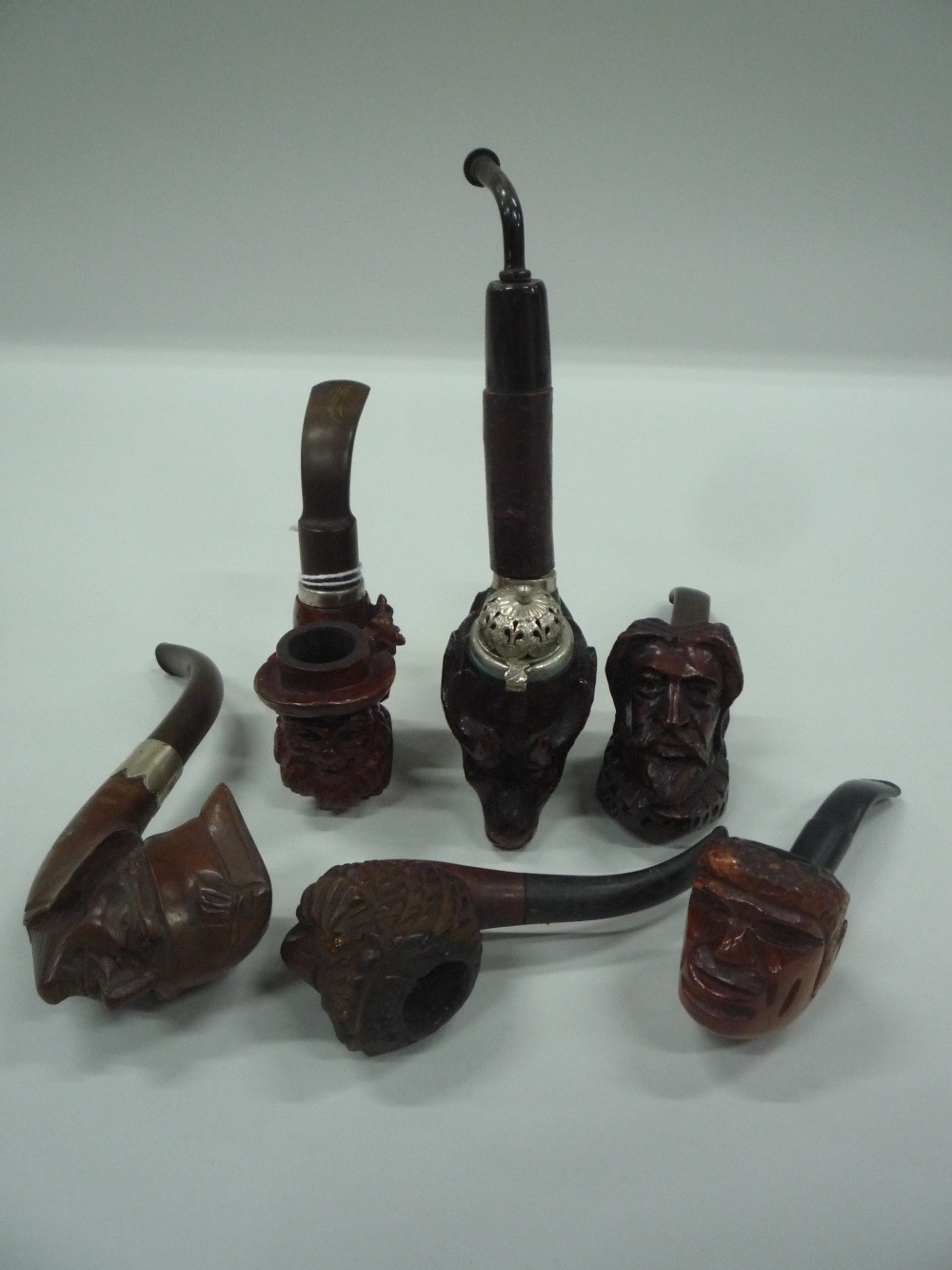 A COLLECTION OF BRIAR PIPES, to include bearded gentleman wearing hat, Stag with white metal mounts,