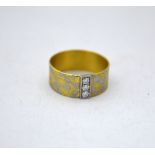 AN 18CT GOLD DIAMOND RING, with three brilliant cut diamonds to the bi-metal band, hallmarks for