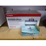 A CANNON DIGITAL IXUS 900TI CAMERA and a Cannon Pixma MP630 all in one photo printer both boxed with