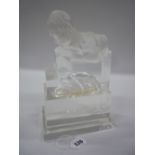 AN OPAQUE GLASS MODERN ART SCULPTURE, with incised nude maiden with gent atop gazing, on stepped