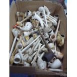 A QUANTITY OF CLAY PIPES, BOWLS, etc, to include figural, harp, foot kicking ball, claw designs, etc