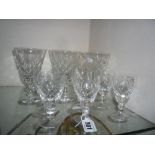 A SET OF SIX CUT GLASS WINE GLASSES, and six cut glass sherry glasses (12)