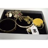 A COLLECTION OF JEWELLERY, to include a charm bracelet, two bracelets etc