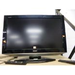 A SHARP 32' LCD TV, with remote