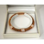 A ROSE GOLD COLOURED MESH BRACELET, with cubic zirconia detail