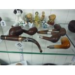 FIVE SILVER BANDED TREE PIPES, one marked Skit, together with Pipe Officier Deposee paris pipe