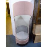 A PINK AND GREY UPHOLSTERED SWIVEL CHAIR, with unusual top section 'Boss Design Group May 14'