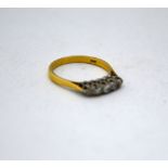 AN 18CT GOLD DIAMOND RING, with five graduated old cut diamonds to the plain tapered shank,