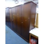 A PAIR OF STAG TWO DOOR WARDROBES, dressing table and a stool (4)