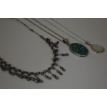 THREE NECKALCES, to include a turquoise necklace, a mother of pearl necklace and a fancy pearl
