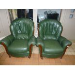 A PAIR OF GREEN LEATHER ARMCHAIRS