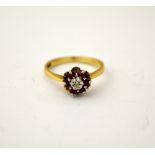 A 9CT GOLD RUBY AND DIAMOND CLUSTER RING, hallmarks for Birmingham, ring size M 1/2