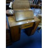 A SMALL ART DECO OAK KNEE-HOLE DESK, with fall front upper section above a single drawer flanked