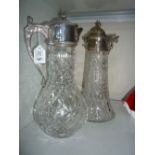 A CUT GLASS CLARET JUG, with silver plated top, together with another, missing a handle (2)