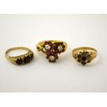 THREE RINGS, to include two cluster and one band ring, one with hallmarks for 9ct gold