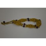 A FANCY BRACELET, comprising of boat shape links, interset with rubies, weight approximately 20.