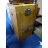 A PAIR OF CAMPHOR WOOD BEDSIDE CABINETS/LOCKERS, with fall fronts
