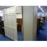 A QUANTITY OF MODERN WHITE BEDROOM FURNITURE, comprising wardrobes, two chest of drawers, dressing