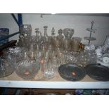 A QUANTITY OF CUT GLASS, two pewter dishes and a pair of candlesticks