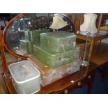 A SUITCASE, three other various cases and a brass table lamp with shade (sd) (5)