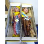 TWO BOXED PELHAM PUPPETS, 'Cowgirl' and 'Clown', both in damaged yellow lidded boxes (clown boxed