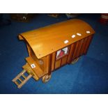 A WOODEN MODEL OF A GYPSY CARAVAN, scratch or kit built, complete with interior and accessories,