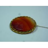 AN EDWARDIAN CORUNDUM BROOCH