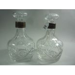 TWO CUT GLASS DECANTERS AND STOPPERS, with silver collars, Sheffield 1979, approximately 22cm