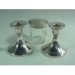 A PAIR OF SILVER DWARF CANDLESTICKS, with filled bases, Birmingham 1931, approximately 9cm high (