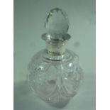 A GLOBULAR CUT GLASS SCENT BOTTLE AND STOPPER, with silver collar, Birmingham 1924, approximately