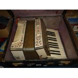 A HOHNER STUDENT II ACCORDIAN, cased