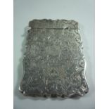 A SILVER SHAPED RECTANGULAR CARD CASE, with engraved floral and leaf decoration, Birmingham 1872,