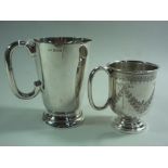 TWO SILVER MUGS, tapering plain form on circular foot, Birmingham 1958, approximately 10.5cm high,
