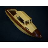 A WOODEN SCRATCHBUILT OR KIT BUILT MOTOR BOAT, engine removed, some other missing items, length