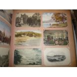 AN EARLY 20TH CENTURY POSTCARD ALBUM, contents loosely inserted, topographical, greetings,