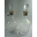 A PAIR OF GLASS PRESENTATION DECANTERS AND STOPPERS, with etched floral, leaf and berry decoration