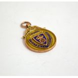 A 9CT GOLD ENAMEL FOOTBALL MEDAL, hallmarks for Birmingham, approximate weight 11.8gms