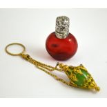 TWO MINIATURE PERFUME BOTTLES, to include a ruby glass perfume bottle together with a smaller