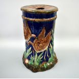 A VICTORIAN MAJOLICA GARDEN SEAT, decorated in relief with cranes and storks over reeds,