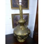 AN ORIENTAL BRASS CONVERTED LAMP, of bulbous form with applied Buddha, floral and hardstone