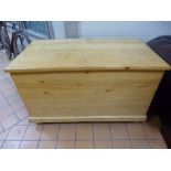 A LARGE PINE BLANKET CHEST, with carrying handles
