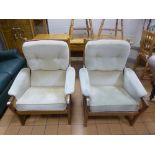 A PAIR OF UPHOLSTERED ARMCHAIRS, with teak frames