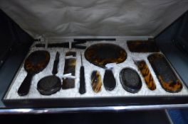 A CASED TORTOISESHELL DRESSING SET