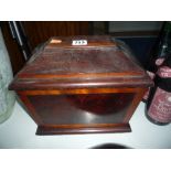A 19TH CENTURY SARCOPHAGUS MAHOGANY AND WALNUT CASKET, with stepped plinth base and hinged lid,
